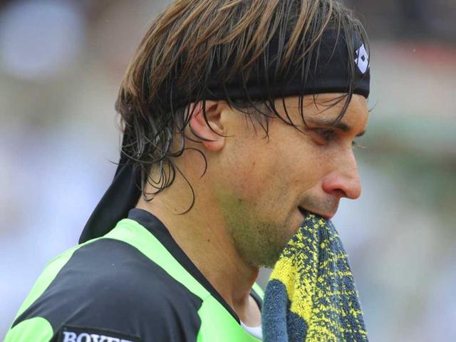 David Ferrer holds his towel in his match against compatriot Rafael Nadal in the final of the French Open tennis tournament, at Roland Garros stadium in Paris. AP Photo David Ferrer holds his towel in his match against compatriot Rafael Nadal in the final of the French Open tennis tournament, at Roland Garros stadium in Paris. AP Photo
