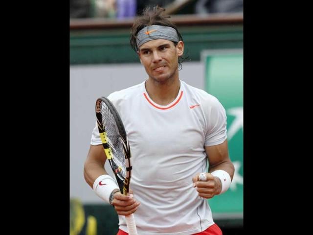 Rafael Nadal reacts after a point against Spain's David Ferrer during their French tennis Open final match at the Roland Garros stadium in Paris. AFP Rafael Nadal reacts after a point against Spain's David Ferrer during their French tennis Open final match at the Roland Garros stadium in Paris. AFP