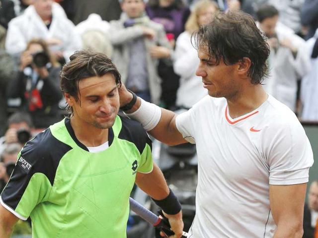 Rafael Nadal pats compatriot David Ferrer on the back after winning their men's singles final match at the French Open final in Paris. Reuters Rafael Nadal pats compatriot David Ferrer on the back after winning their men's singles final match at the French Open final in Paris. Reuters