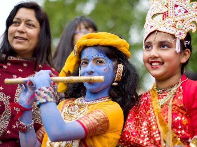 Children dressed in costumes, representing Lord Krishna and Radha, pose for a photograph during the "Ratha-yatra" or Festival of Chariots, as the procession travels through Central London. The procession, currently in its 45th year, sees thousands of Krishna devotees pull three brightly decorated chariots bearing the Hindu dieties, Lord Jagannatha, Lady Subhadra and Lord Balarama from Hyde Park to Trafalgar Square. (AFP)