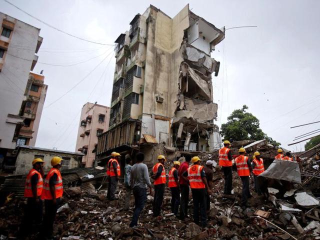 Rescue workers search through the rubble at the site of a collapsed residential building in Mumbai. One person was killed and four were rescued from under rubble when a section of the building collapsed in central Mumbai, local media quoted officials as saying. REUTERS