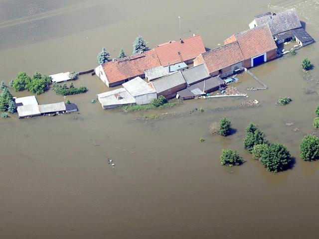 Aerial view shows houses submerging in the floodwaters of the river Elbe in Fischbeck, eastern Germany. Deadly floods forging a path of devastation through central Europe for more than a week bore down on northern Germany as troops raced to bolster sodden dykes. AFP