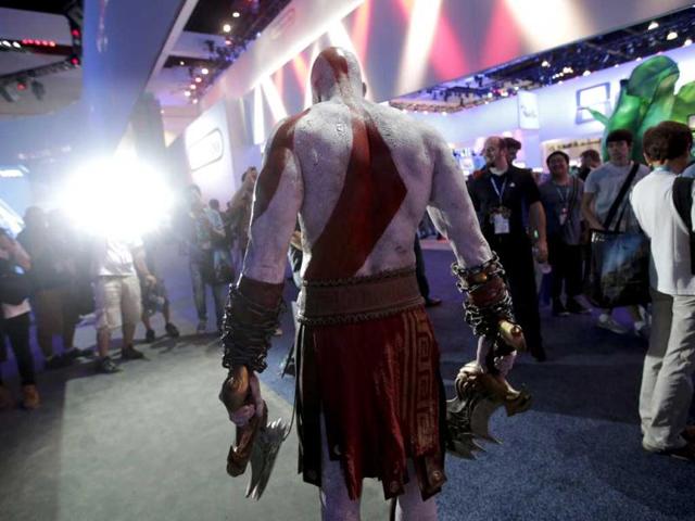 Kratos, a video game character from the God of Wa, poses for photos during the Electronic Entertainment Expo in Los Angeles. (AP)