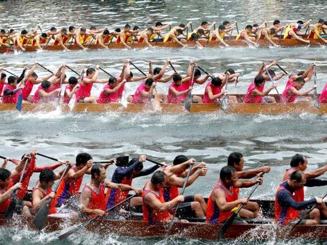 Participants compete in a dragon boat race during the dragon boat festival in Hong Kong. The festival, falling on the fifth day of the fifth lunar month, is in remembrance of Qu Yuan, a patriotic poet who committed suicide in the Miluo River after he was exiled. AP