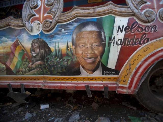 A painting depicting former South African President Nelson Mandela is featured on the side of a public bus in Port-au-Prince in Haiti. (AP)