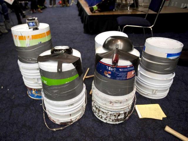 Percussion instruments made of buckets and pans, used by members of Stomp, sit on the sidelines of a press conference to promote their show in Mexico City. (AP)