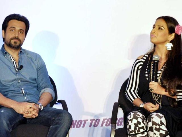 "Naah, I don't think so..." Vidya Balan (right) looks pensive while Emraan Hashmi looks on during the Ghanchakkar promotions. (AFP Photo)