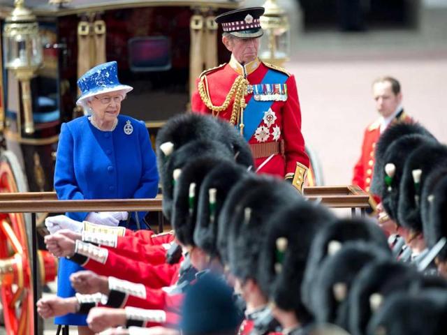 Britain's Queen Elizabeth II reviews troops from the Household division outside Buckingham Palace, with the Duke of Kent, after the Trooping the Colour ceremony in central London. Reuters