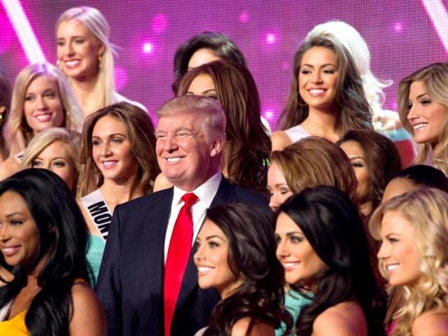 Donald Trump, co-owner of the Miss Universe Organization, poses for a photo with the 2013 Miss USA Delegates during rehearsal for the upcoming Miss USA Competition at PH Live in Las Vegas, Nevada. AFP