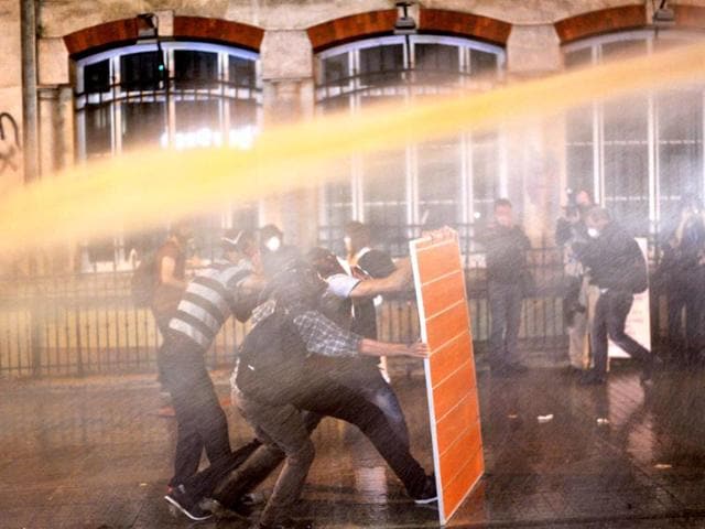 Riot police use water cannon to disperse protestors at Istiklal street near Taksim square in Istanbul. AFP