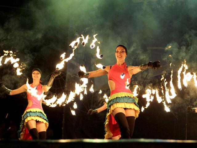 Participants whirl symbolic firebrands around to form patterns in the air during the Kiev Fire Fest in Kiev, Ukraine. AP