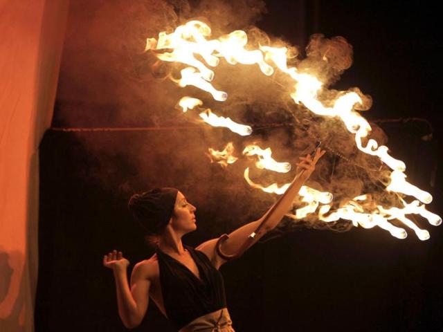 A participant whirls a symbolic firebrand around to form patterns in the air during the Kiev Fire Fest in Kiev, Ukraine. AP photo
