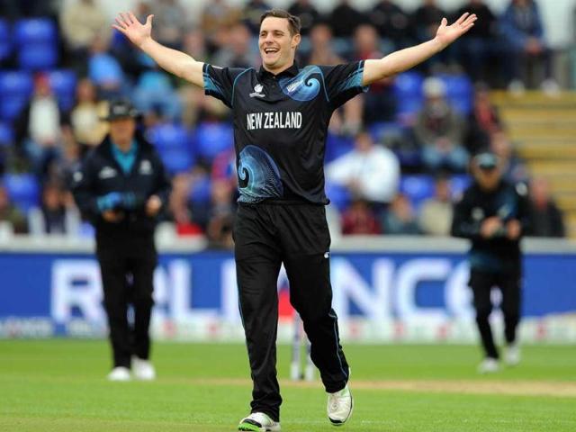 Mitchell McClenaghan celebrates after claiming the wicket of England's Joe Root during the 2013 ICC Champions Trophy cricket match between England and New Zealand at the Cardiff Wales Stadium in Cardiff, south Wales. AFP Photo