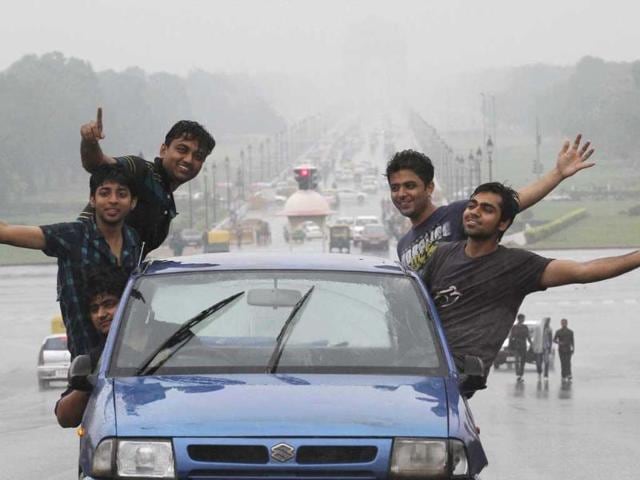 A group of boys enjoying the first monsoon shower of the season near Rajpath in New Delhi. HT/Arvind Yadav