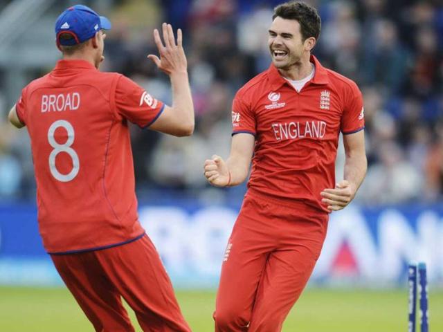 James Anderson (R) celebrates with teammate Stuart Broad after dismissing New Zealand's Martin Guptill during the ICC Champions Trophy group A match at Cardiff Wales Stadium in Wales. Reuters