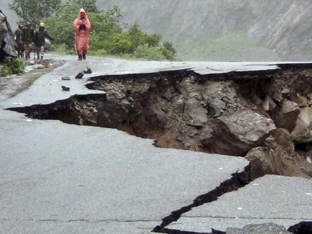 Road caved in after incessant rains on Rishikesh-Mana highway near Joshimath district in northern Indian state of Uttarakhand. PTI
