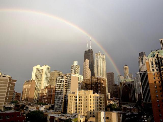 A rainbow appears over Chicago after a quick rain shower. (AP Photo)