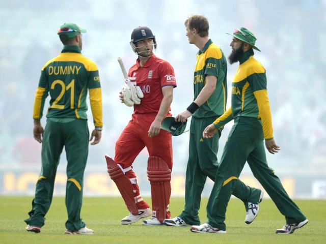 England's Jonathan Trott leaves the field with South Africa's JP Duminy (L), Chris Morris (2nd R) and Hashim Amla (R) after England won the ICC Champions Trophy semi final match at The Oval, London. Reuters