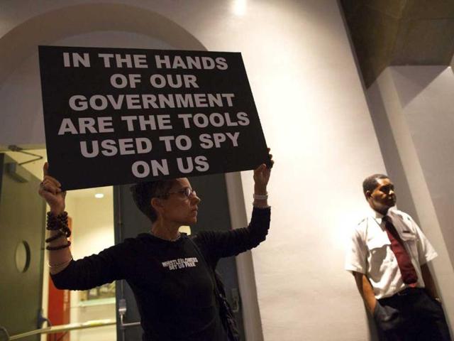A woman holds up a sign at a support rally for Edward Snowden in New York. (Reuters)