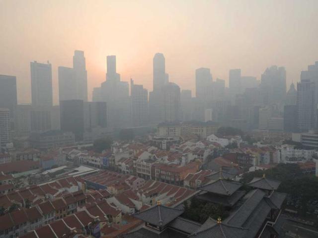 The Central Business District of Singapore is shrouded by unhealthy levels of haze. Air pollution in Singapore has soared to record heights as Indonesia prepared planes and helicopters to battle raging fires blamed for hazardous levels of smoky haze in three countries. AP