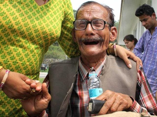 An-elderly-stranded-pilgrim-is-consoled-by-his-relative-after-being-rescued-from-the-upper-reaches-of-Uttarakhand-in-Dehradun-PTI An-elderly-stranded-pilgrim-is-consoled-by-his-relative-after-being-rescued-from-the-upper-reaches-of-Uttarakhand-in-Dehradun-PTI