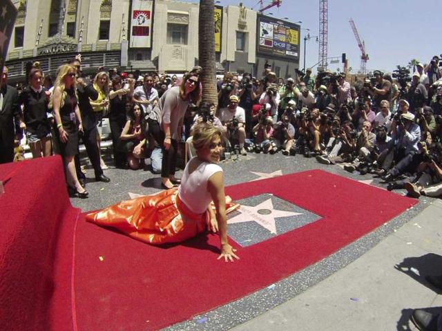 Jennifer Lopez has been honored with the 2,500th star on the Hollywood Walk of Fame, in Hollywood, California (Reuters Photo). Check out the actress pose on her star. 