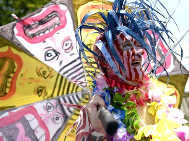 A parade participant arrives in costume for the 31st Annual Mermaid Parade at New York's Coney Island. Over 700,00 people are exptected to turn out for the scantily clad parade. (AFP)