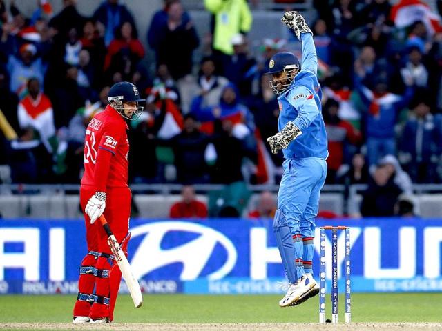 MS Dhoni celebrates victory as England's James Tredwell watches during their ICC Champions Trophy final match at Edgbaston ground in Birmingham. Reuters