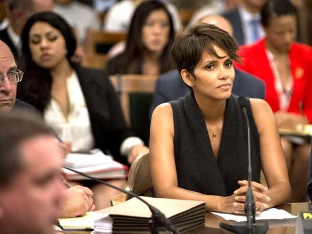 Actress Halle Berry testifies before the Assembly Committee on Public Safety for a bill that would limit the ability of paparazzi to photograph children of celebrities and public figures at the Capitol in Sacramento, California. (AP)