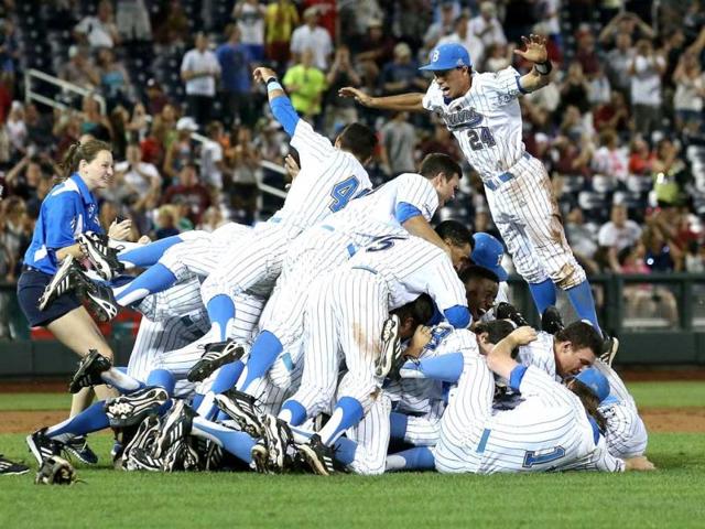 Te UCLA Bruins jump into a pile to celebrate after getting the final out against the Mississippi State Bulldogs during game two of the College World Series Finals at TD Ameritrade Park in Omaha, Nebraska. (AFP)