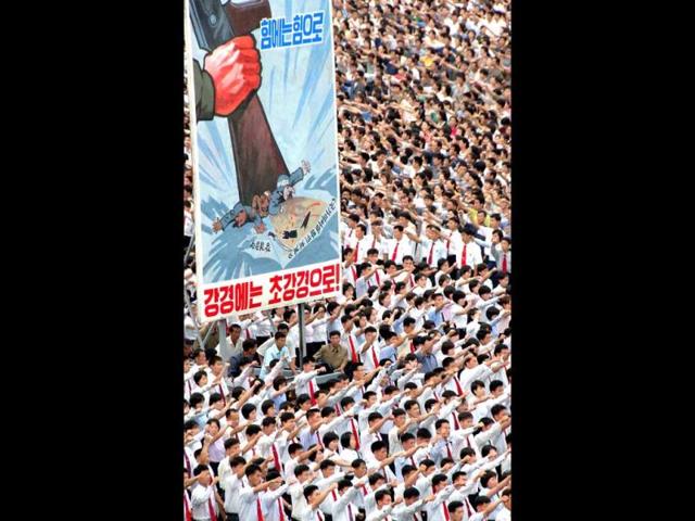 Photo released by North Korea's official Korean Central News Agency (KCNA) shows residents attending the "anti-US imperialism" rally on the 63rd anniversary of the outbreak of the Korean War at Kim Il-Sung Square in Pyongyang. (AFP/KCNA via KNS)