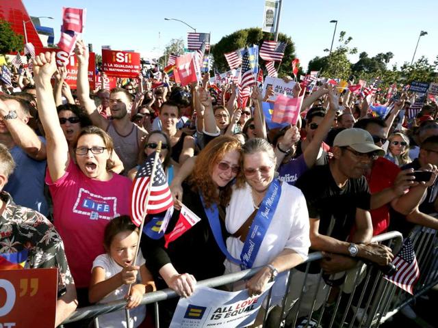 Deirdre Weaver and her wife Nancy Grass hug at a rally in West Hollywood, California after the US Supreme Court ruled on California's Proposition 8 and the federal Defense of Marriage Act. Reuters