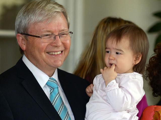 Kevin Rudd holds granddaughter Josephine after he was sworn in as Australia's new prime minister at Government House in Canberra. AFP