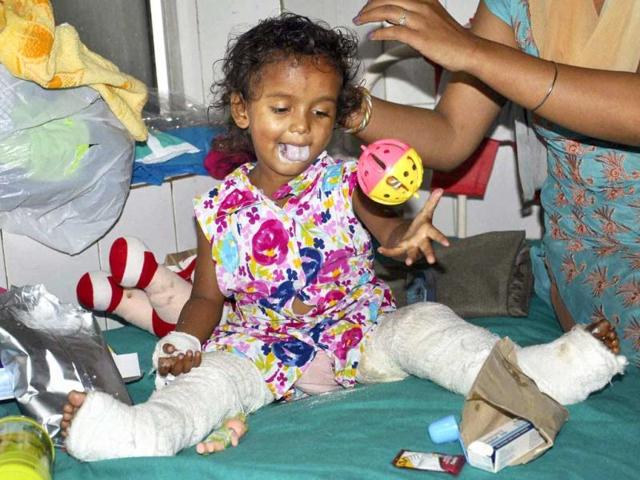 A three year old girl child injured in the flood in Kedarnath admitted in a hospital in Dehradun on Thursday. PTI