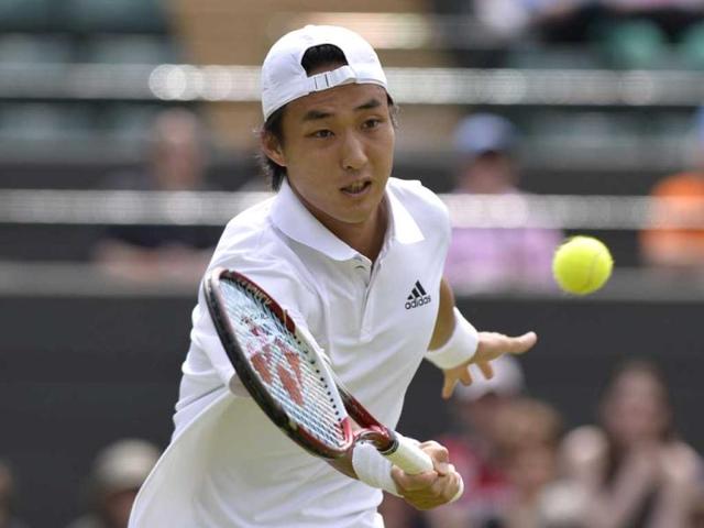Japan's Go Soeda returns against France's Richard Gasquet during their second round men's singles match on day four of the 2013 Wimbledon Championships tennis tournament at the All England Club in Wimbledon, southwest London. AFP Photo