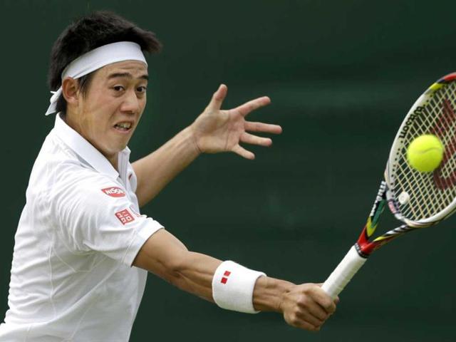 Kei Nishikori of Japan returns to Leonardo Mayer of Argentina during their Men's second round singles match at the All England Lawn Tennis Championships in Wimbledon, London. AP Photo