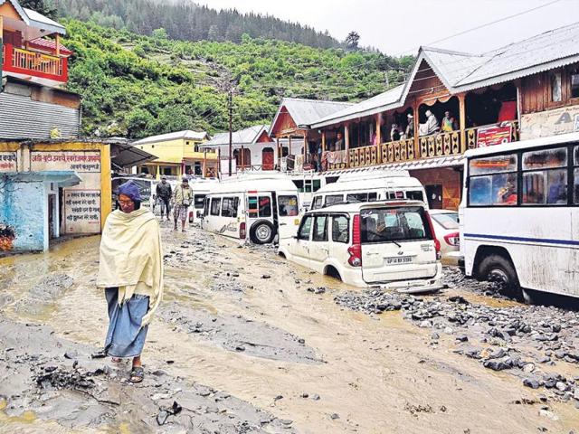 On June 17, the flood waters were still sweeping through Dharali, burying vehicles in deep silt. (HT Photo/Prasad Nichenametla)