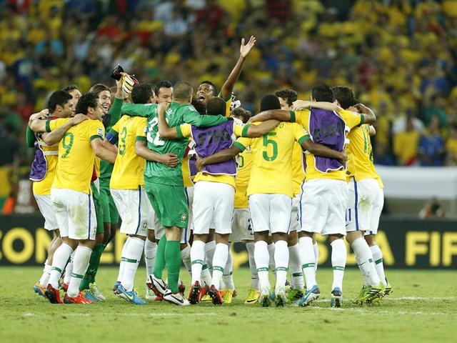 Brazil players celebrate winning the Confederations Cup final between Brazil and Spain at the Maracana stadium in Rio de Janeiro, Brazil. AP