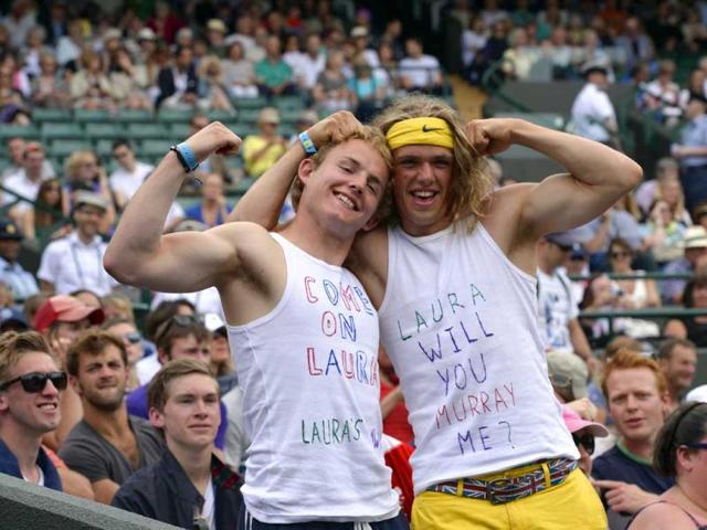 Two Robson fans pose for a picture ahead of the Wimbledon fourth round women's singles match between Laura Robson and Kaia Kanepi. AFP Photo
