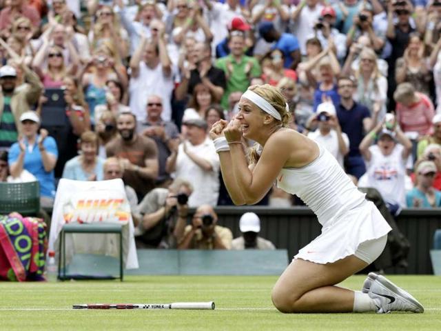 Sabine Lisicki reacts after beating Serena Williams at in round four of the Wimbledon tournament in London. AP Photo