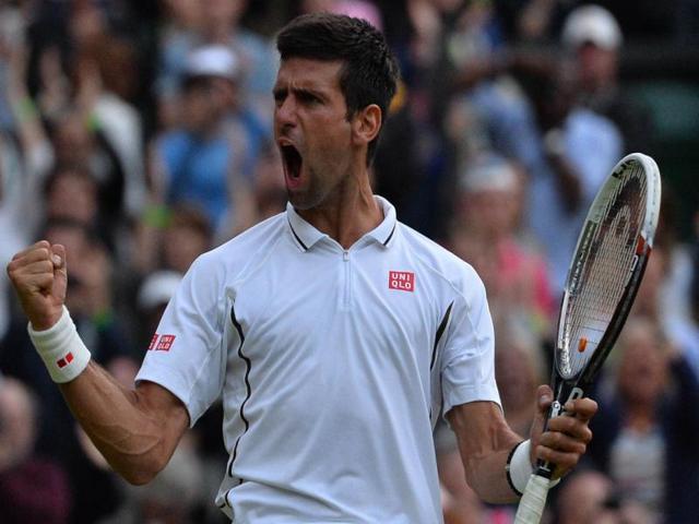 Novak Djokovic celebrates after beating Tommy Haas during their fourth round men's singles match at the Wimbledon Championships. AFP Photo