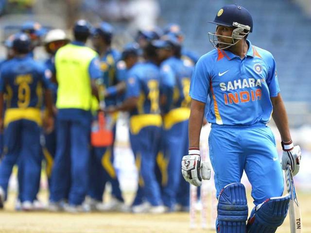 Rohit Sharma leaves the field after being dismised during the third match of the Tri-Nation Series between India and Sri Lanka at Sabina Park. AFP Photo