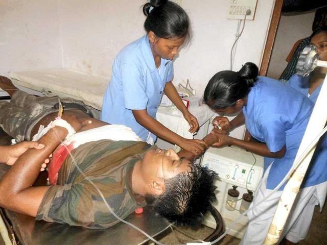 An injured policeman being treated at a hospital after landmine explosion triggred by maoist rebels at Kathikund, Dumka, Jharkhand. PTI Photo