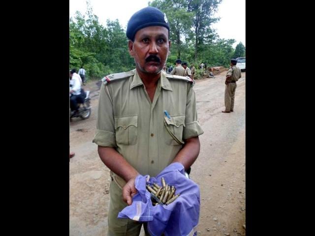 A policeman holds ammunition after a Maoist attack in Kathikund, Jharkhand. AFP Photo