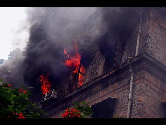 The third floor of government estate exchange building caught fire due to short circuit at Ballard Pier in South Mumbai. (PTI Photo)
