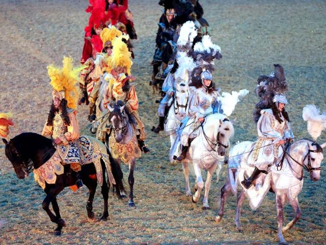 Riders, symbolizing princes willing to conquer Apollo, perform in a mythological stage during the show "Les Chevaux du soleil" (Sun's horses) at Le Grand Carrousel Royal in Versailles, Paris. AFP