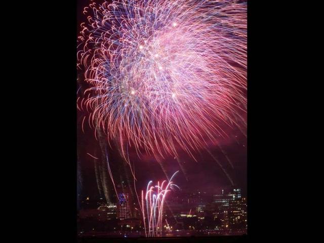 Fireworks explode over the Philadelphia Museum of Art and a statue of George Washington during Independence Day celebrations in Philadelphia. (AP)