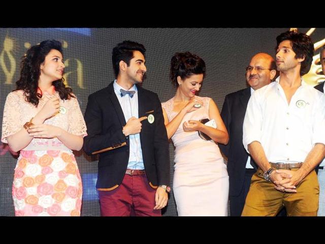 The youth brigade: Parineeti Chopra, Ayushmann Khurrana and Shahid Kapoor smile as they gather on the IIFA stage. Gauhar Khan is also seen in the picture. (AFP Photo)
