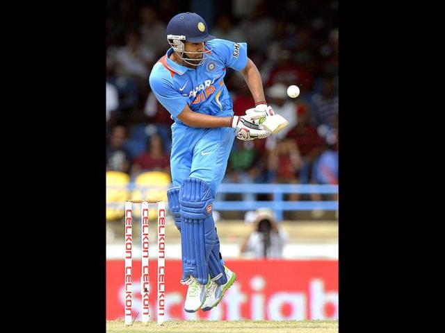 Rohit Sharma plays a shot during the fourth match of the Tri-nation series between India and West Indies at the Queen's Park Oval in Port of Spain. (AFP)