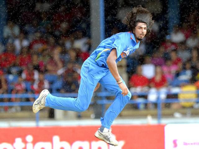 Ishant Sharma eyes the ball after a delivery under rain during the fourth match of the Tri-nation series between India and West Indies at the Queen's Park Oval in Port of Spain. (AFP)